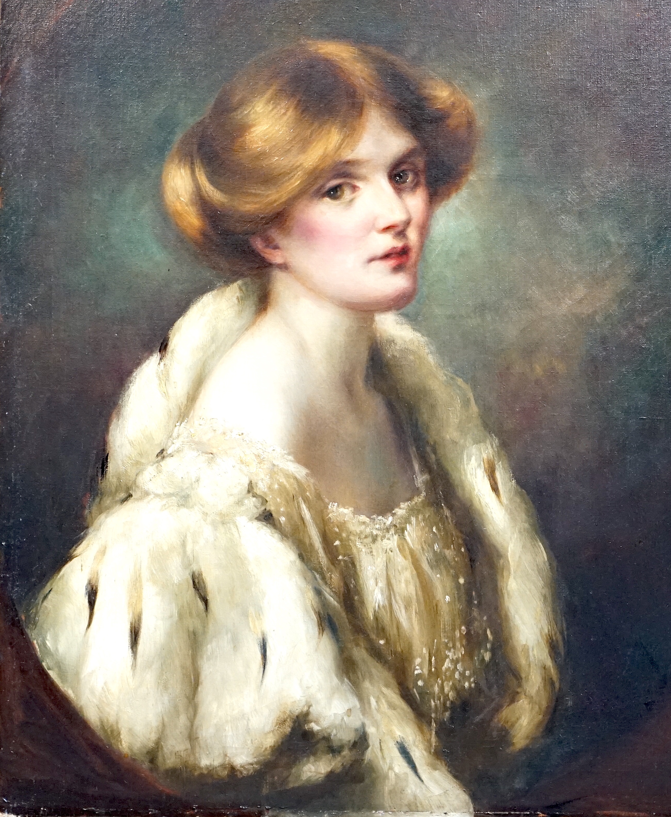 English School c.1900, oil on canvas, Portrait of a young lady wearing an ermine trimmed cape, painted to the oval, 77 x 64cm, unframed